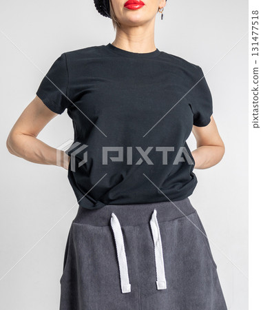 Close-up black clothes on woman on light background. Vertical photo. High quality photo Close-up black clothes on woman on light background. Vertical photo. High quality photo 131477518