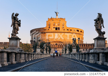 Rome in morning. Panoramic view of Castel Sant'Angelo and Bridge in Rome with sculptures statues on bridge. High quality photo 131477524