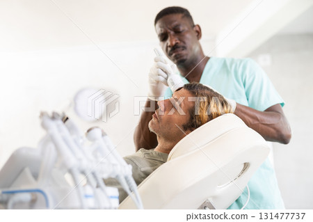 surgeon employs cold hammer 131477737