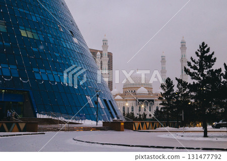 Modern architectural urbanistic city Astana. Futuristic buildings, pyramids, mosque of night city, Nur-Sultan, Astana, Kazakhstan. High quality photo 131477792
