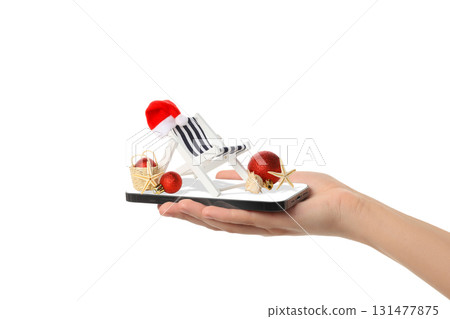 Hand holds a holiday-themed beach chair, isolated, PNG Hand holds a holiday-themed beach chair, isolated, PNG 131477875