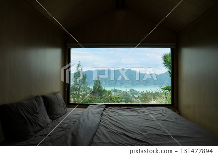 Relaxing retreat showcases beautiful lake and mountain view Relaxing retreat showcases beautiful lake and mountain view 131477894