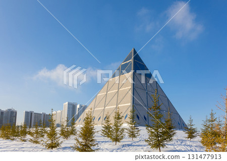 Palace of Peace and Accord. Modern architectural urbanistic city Astana. Futuristic building pyramids on sunny winter day, Nur-Sultan, Astana, Kazakhstan. High quality photo 131477913