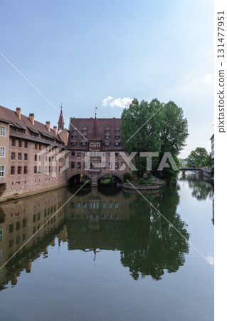 Famous view of Glasses of Nuremberg Heilig-Geist-Spital in old city Nuremberg in Franconia, Bavaria, Germany. Historical center of Nurnberg in Pegnitz River. High quality photo Famous view of Glasses of Nuremberg Heilig-Geist-Spital in old city Nuremberg in Franconia, Bavaria, Germany. Historical center of Nurnberg in Pegnitz River. High quality photo 131477951