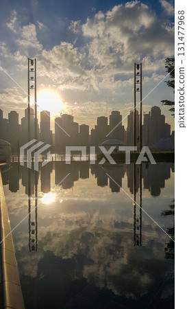 Panoramic view of Business Bay district with reflection in sea in morning. Aerial sky at highest buildings in central Dubai, United Arab Emirates Panoramic view of Business Bay district with reflection in sea in morning. Aerial sky at highest buildings in central Dubai, United Arab Emirates 131477968
