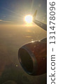 View from airplane porthole to beautiful sunset, blue sky and air clouds. High quality photoView from airplane porthole to beautiful sunset, blue sky and air clouds 131478096