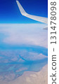 View from the window of plane on blue sky and earth with landscape of desert, sea and canals in Emirates. High quality photo 131478098
