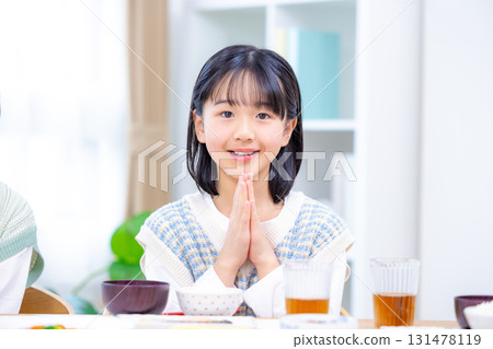 Family meal Girl eating rice 131478119