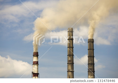 Thermal power station tall pipes with thick smoke. Pollution of environment concept. Thermal power station tall pipes with thick smoke. Pollution of environment concept. 131478446