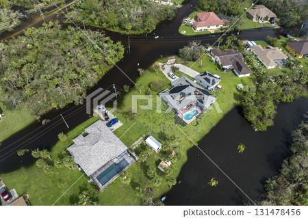 Surrounded by hurricane Ian rainfall flood waters homes in Florida residential area. Aftermath of natural disaster 131478456