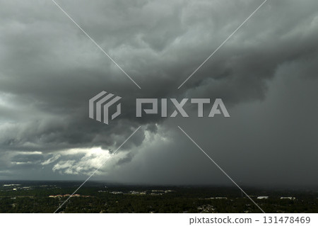 Stormy clouds forming during thunderstorm on dark sky. Moving and changing cloudscape weather Stormy clouds forming during thunderstorm on dark sky. Moving and changing cloudscape weather 131478469