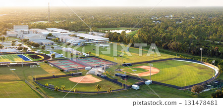 Sports facilities at public school in North Port, Florida. American football stadium, tennis court and baseball diamond sport infrastructure 131478481