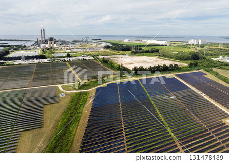 Solar energy replacing fossil fuel power at Big Bend Power Station near Tampa, Florida. Clean electricity production through photovoltaic panels in a large-scale utility setup 131478489
