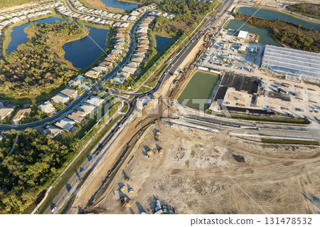 Roundabout construction roadworks on American transport infrastructure. Renovation of highway road with moving traffic. Development of interstate transportation concept 131478532