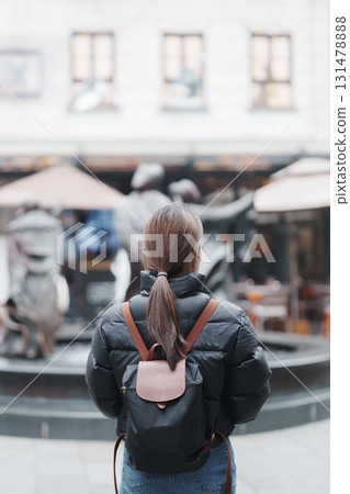 woman traveler visiting in Shanghai, China. Female Tourist with backpack sightseeing in Xintiandi. landmark and popular for tourism attractions in Shanghai. Travel and vacation concept 131478888
