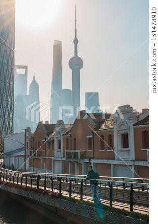 man traveler visiting in Shanghai, China. male Tourist with backpack sightseeing Shanghai view of Lujiazui in Hongkou Gang canal of Shanghai. landmark and popular for tourism attraction man traveler visiting in Shanghai, China. male Tourist with backpack sightseeing Shanghai view of Lujiazui in Hongkou Gang canal of Shanghai. landmark and popular for tourism attraction 131478910