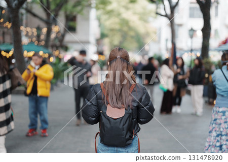 woman traveler visiting in Shanghai, China. Female Tourist with backpack sightseeing in Xintiandi. landmark and popular for tourism attractions in Shanghai. Travel and vacation concept woman traveler visiting in Shanghai, China. Female Tourist with backpack sightseeing in Xintiandi. landmark and popular for tourism attractions in Shanghai. Travel and vacation concept 131478920