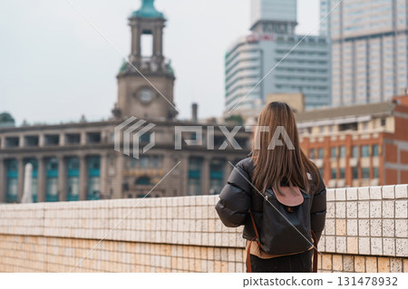 woman traveler visiting in Shanghai, China. Happy Female Tourist sightseeing Shanghai view. landmark and popular for tourism attractions. Travel and vacation concept woman traveler visiting in Shanghai, China. Happy Female Tourist sightseeing Shanghai view. landmark and popular for tourism attractions. Travel and vacation concept 131478932