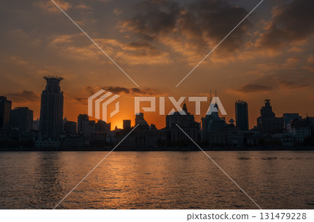 Cityscape view of Shanghai city at sunset. Skyscraper of the Bund, view from Lujiazui in Pudong of Shanghai, China. landmark and popular for tourism attractions. Travel and Vacation concept Cityscape view of Shanghai city at sunset. Skyscraper of the Bund, view from Lujiazui in Pudong of Shanghai, China. landmark and popular for tourism attractions. Travel and Vacation concept 131479228