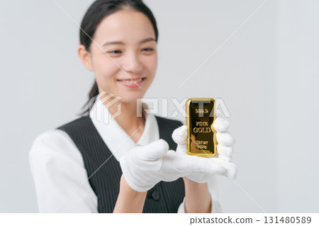 A woman appraising precious metals 131480589