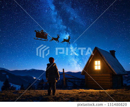 Christmas market and illuminated wooden stalls in a snowy landscape 131480820