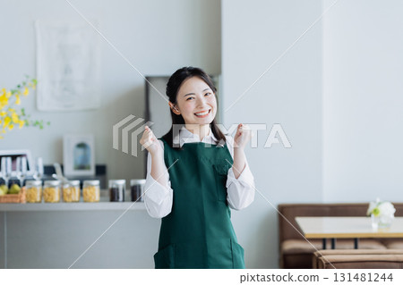 A young woman working in a cafe 131481244