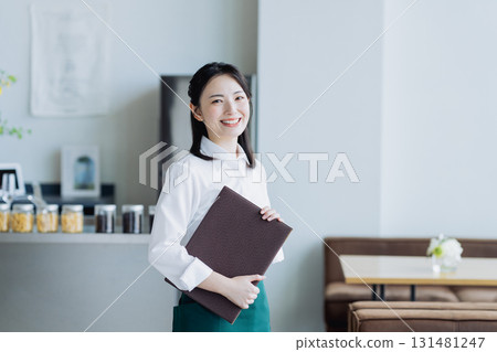 A young woman working in a cafe 131481247