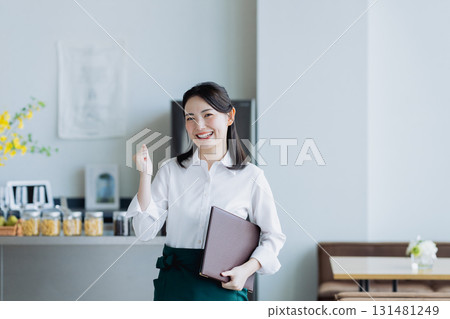 A young woman working in a cafe A young woman working in a cafe 131481249