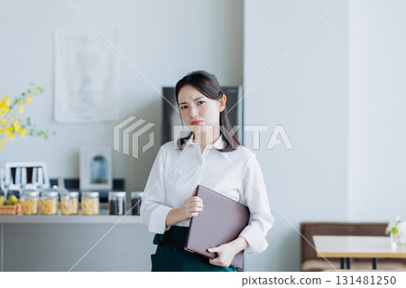 A young woman working in a cafe 131481250