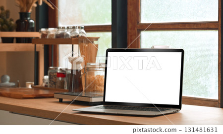 Blank laptop screen for mockup on countertop with healthy ingredients Blank laptop screen for mockup on countertop with healthy ingredients 131481631