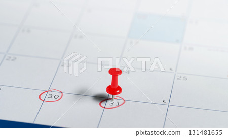 Red tack on circled date on monthly planner, representing schedule planning, or business appointment 131481655