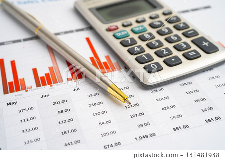 Pencil and calculator on chart or graph paper. Financial, account, statistics and business data. 131481938