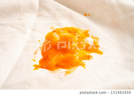Dirty tomato sauce stain or ketchup on cloth. 131481939