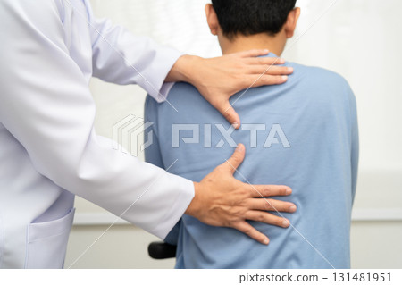 Physical therapy, Asian therapist doctor treat perform pain young man in hospital. 131481951
