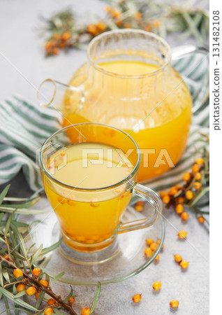 Sea buckthorn herbal tea with berries and leaves Sea buckthorn herbal tea with berries and leaves 131482108