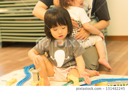 Toddler girl playing with toys Toddler girl playing with toys 131482245