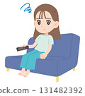 A woman who can't concentrate on the TV 131482392