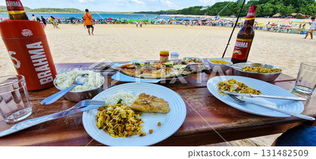 Alter do Chao, Brazil - Dec 15, 2024: Traditional food at the lovely beach of Ilha do Amor in Alter do Chao, Brazil Alter do Chao, Brazil - Dec 15, 2024: Traditional food at the lovely beach of Ilha do Amor in Alter do Chao, Brazil 131482509