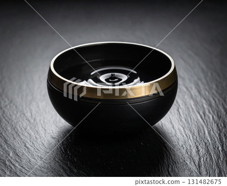 empty black bowl on a wooden table 131482675