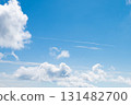 Beautiful blue sky with floating clouds 131482700