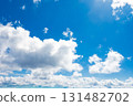 Beautiful blue sky with floating clouds 131482702