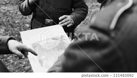 Historical Re-enactment Black And White . World War II German wehrmacht Soldier officer Commander Soldiers Of World War II Briefs, Showing Direction Of A Attack On Map 131483092