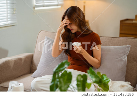 Woman feeling sick and headache, health care concept. 131483196