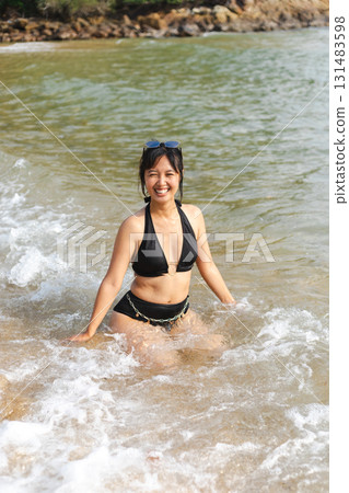 happily playing in the sea 131483598