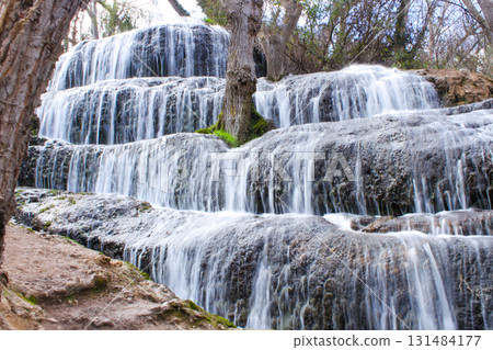 Stepped waterfalls in a forest stream, Spain 131484177