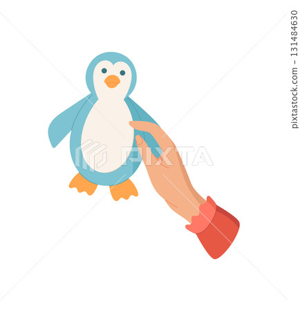 Hand holds a cute penguin toy in a colorful cartoon graphic style. The image captures the joy of craft and DIY activities for children. Concept of creativity, playfulness, and artistic expression. Hand holds a cute penguin toy in a colorful cartoon graphic style. The image captures the joy of craft and DIY activities for children. Concept of creativity, playfulness, and artistic expression. 131484630