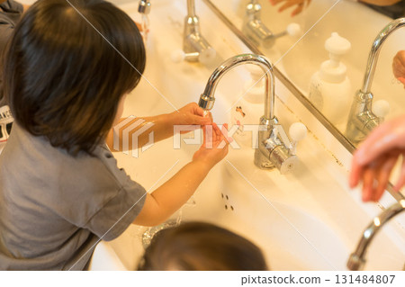 Children washing their hands at a nursery school Children washing their hands at a nursery school 131484807