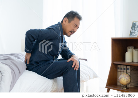 A middle-aged man who wakes up feeling unwell in the morning 131485000