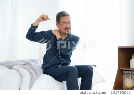 A middle-aged man who wakes up feeling unwell in the morning A middle-aged man who wakes up feeling unwell in the morning 131485002