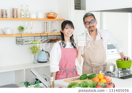 Middle-aged couple cooking in the kitchen Middle-aged couple cooking in the kitchen 131485056